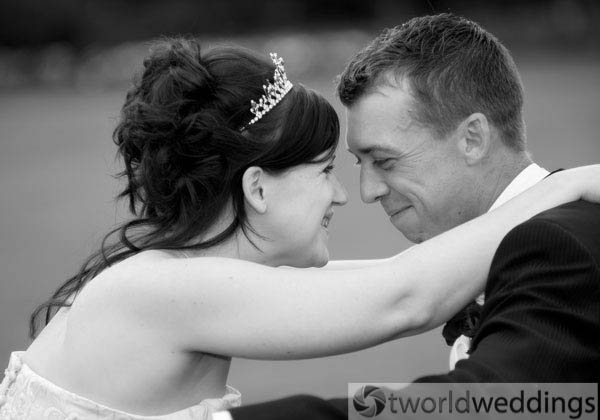 Happy couple photographed at their wedding by wedding photographers TWorld Weddings
