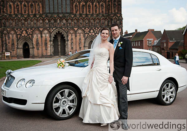 Bride and groom outside Lichfield Cathedral on their wedding day. Photo by TWorld Weddings